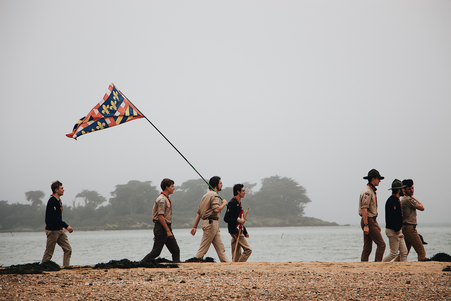 People Walking Near Beach Line